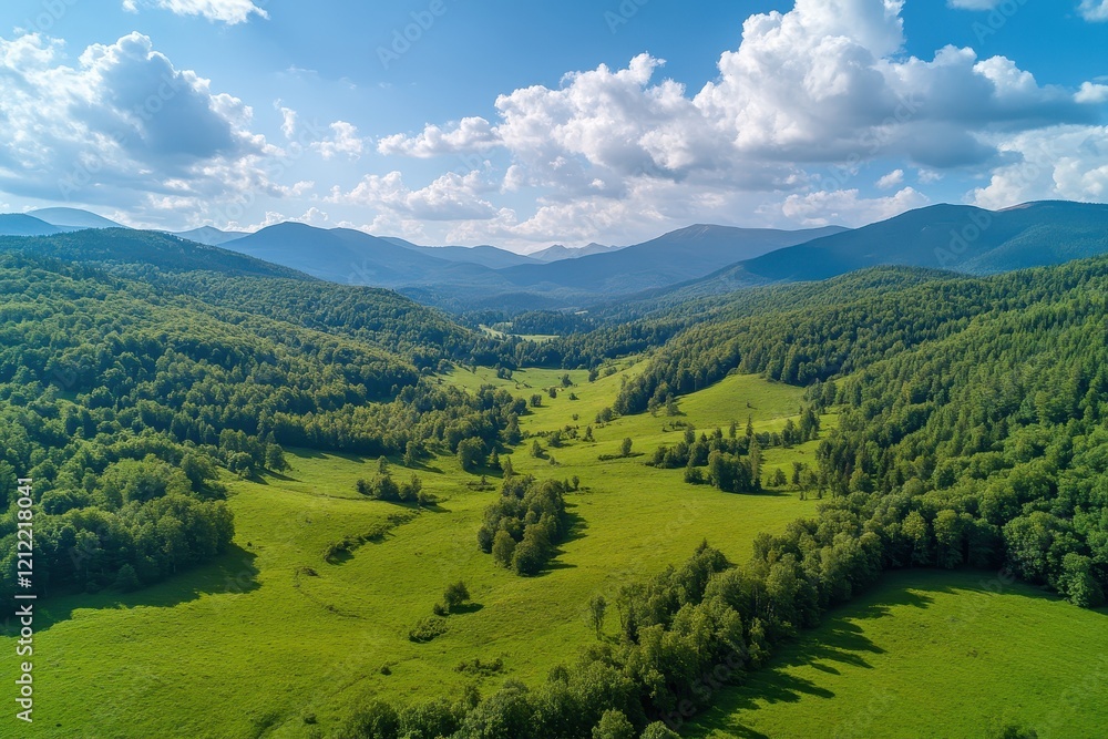 Aerial view lush green valley, mountain range, sunny day, cloud-filled sky, nature background Aerial view lush green valley, mountain range, sunny day, cloud-filled sky, nature background