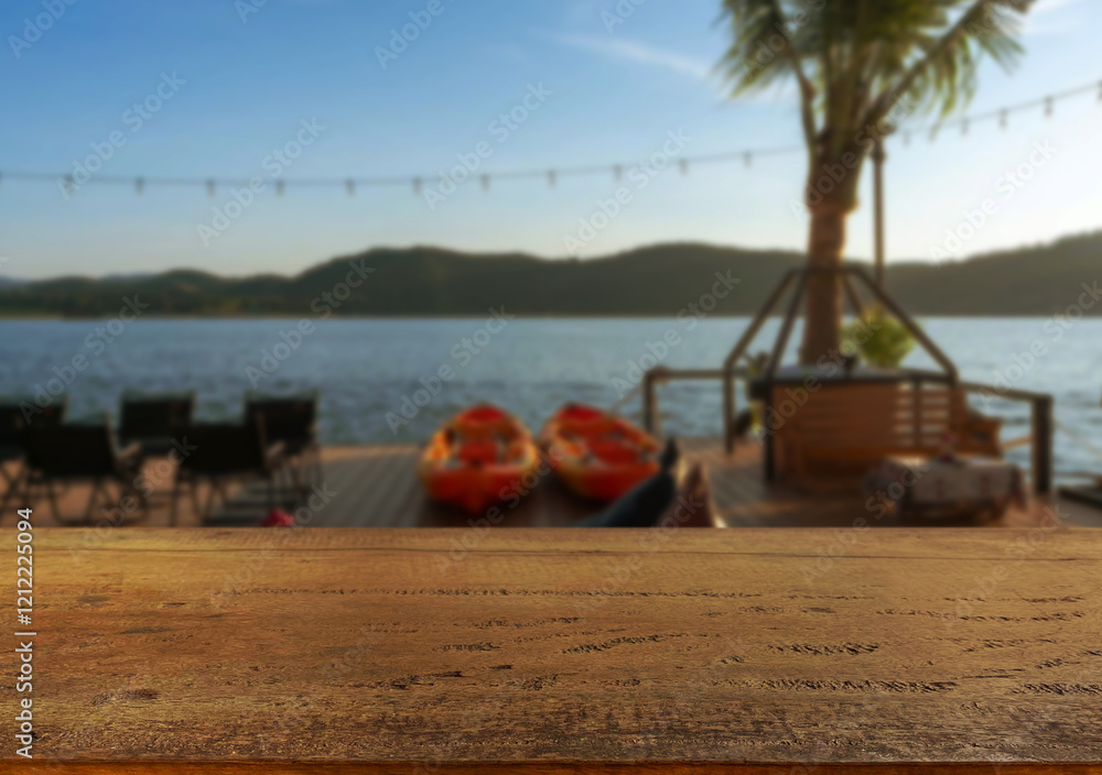Fototapeta premium Wooden table top on blur night restaurant or cafe on the beach background.For montage product display or design key visual layout.View of copy space.