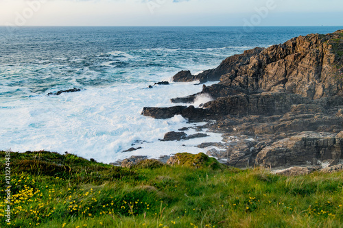 Rough and rocky shore at Malin Head, Ireland's northernmost point, Wild Atlantic Way, spectacular coastal route. Numerous Discovery Points. Co. Donegal photo