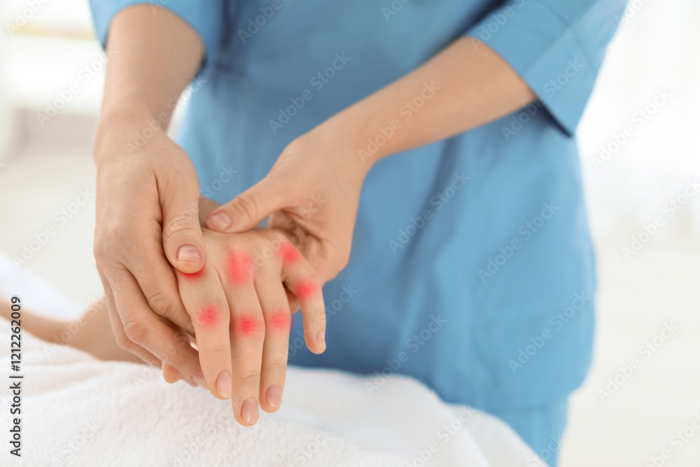 Woman with joint inflammation receiving hand massage in wellness center, closeup Woman with joint inflammation receiving hand massage in wellness center, closeup