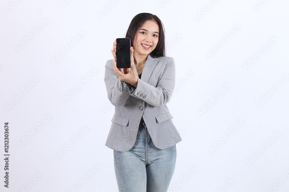 Smiling beautiful young Asian woman wearing gray suit showing a screen mobile phone Smiling beautiful young Asian woman wearing gray suit showing a screen mobile phone