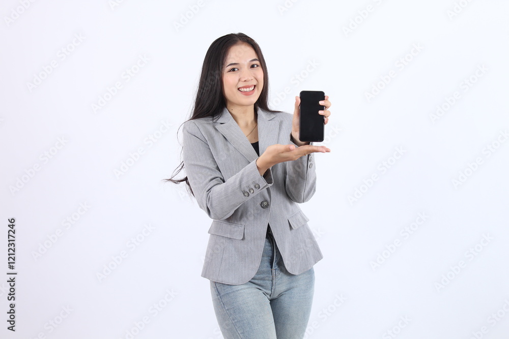 Woman in a gray blazer showing and presenting a blank screen. Business asian woman Woman in a gray blazer showing and presenting a blank screen. Business asian woman