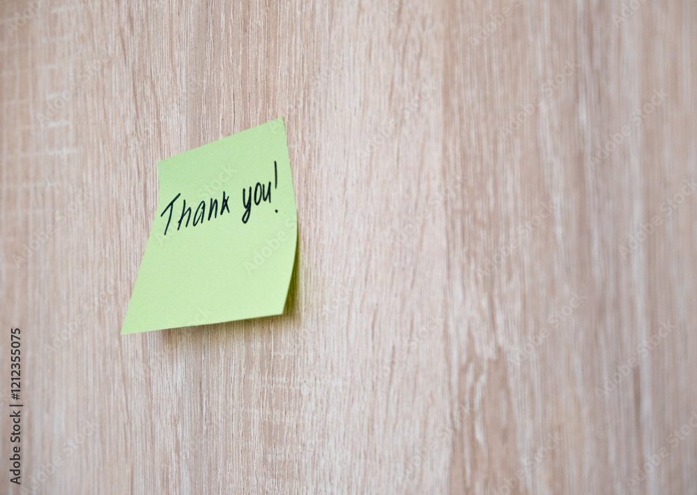 Sticker with the inscription thank you on a wooden wall. Day Thank you. Sticker with the inscription thank you on a wooden wall. Day Thank you.
