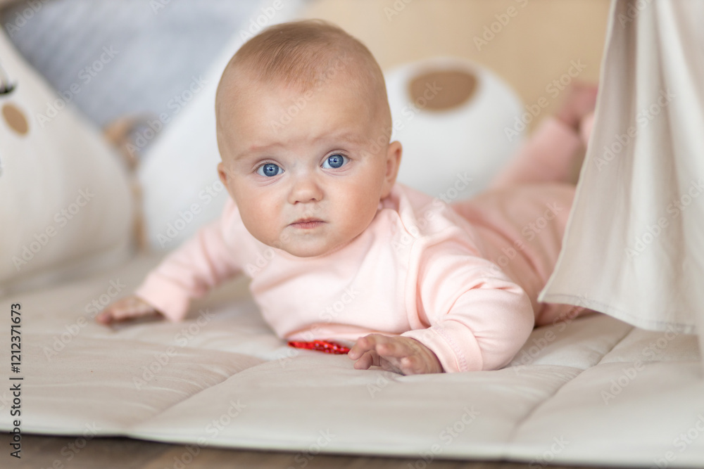 Baby Lying on Soft Mat Looking at Camera in Cozy Room
Baby Lying on Soft Mat Looking at Camera in Cozy Room