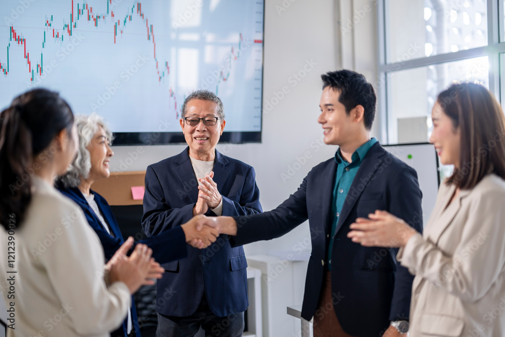 A group of people are shaking hands in a business setting A group of people are shaking hands in a business setting