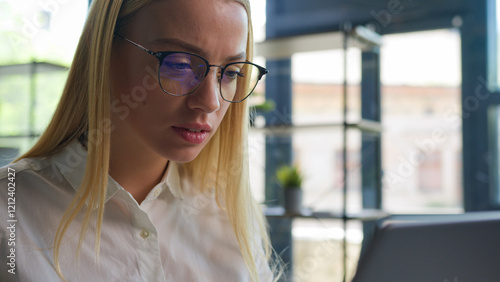 Caucasian female business girl manager worker ceo executive businesswoman at office desk focused woman working typing project on laptop computer online work project startup chatting with clients email
