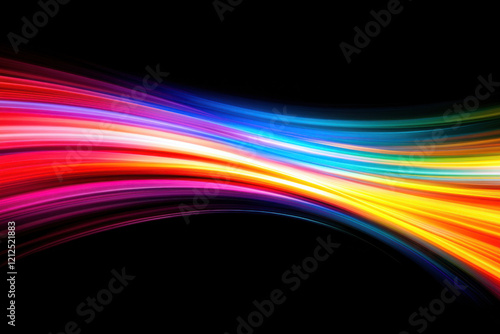 Abstract light trails in vibrant colors on a black background photo