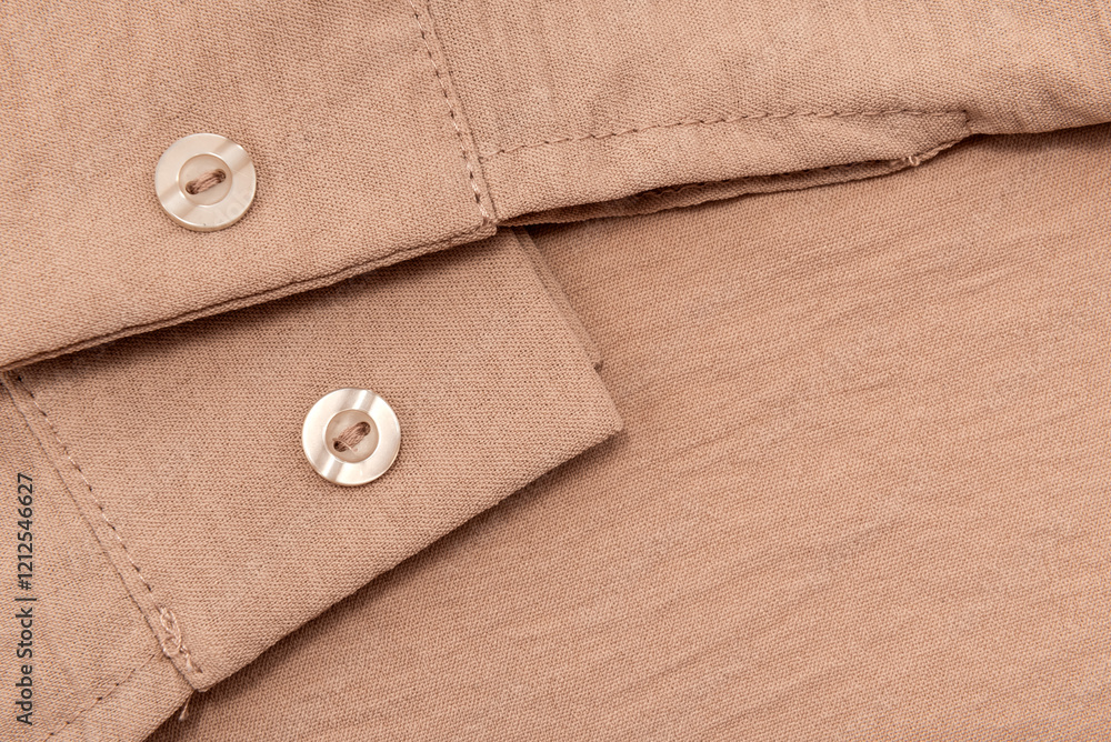 Close-up of brown shirt sleeve with buttons. brown men's shirt Close-up of brown shirt sleeve with buttons. brown men's shirt