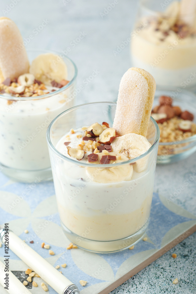 Milk mousse dessert with nuts in glasses Milk mousse dessert with nuts in glasses