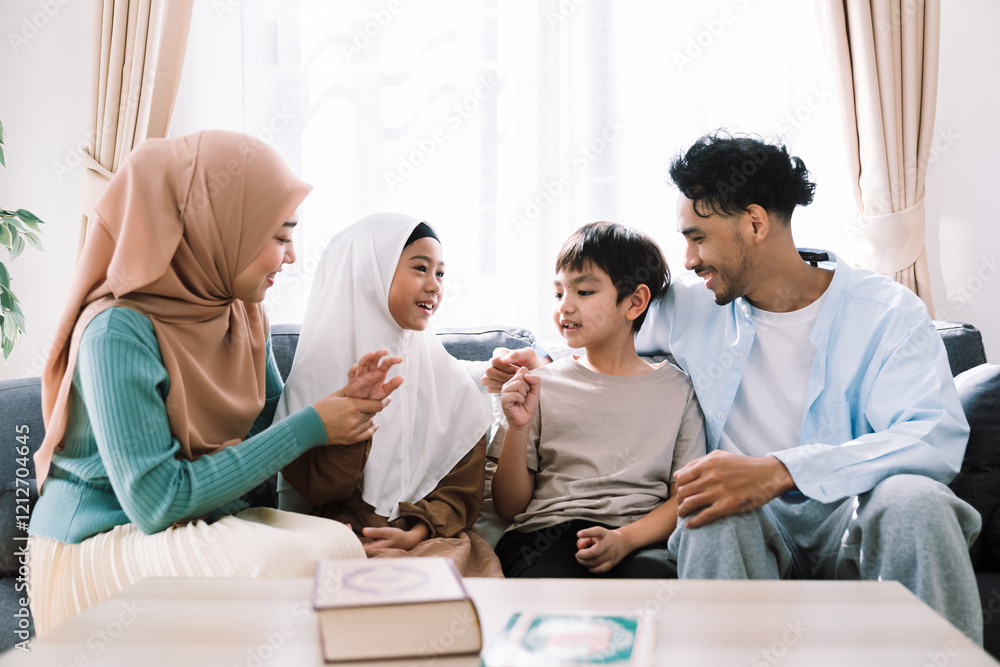 Muslim family lifestyle indoors, mother in hijab with father and children, enjoying peaceful times, learning the Quran, and cherishing togetherness in a cozy living room. Muslim family lifestyle indoors, mother in hijab with father and children, enjoying peaceful times, learning the Quran, and cherishing togetherness in a cozy living room.