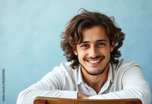 Portrait of a calm man with long hair and a gentle smile photo