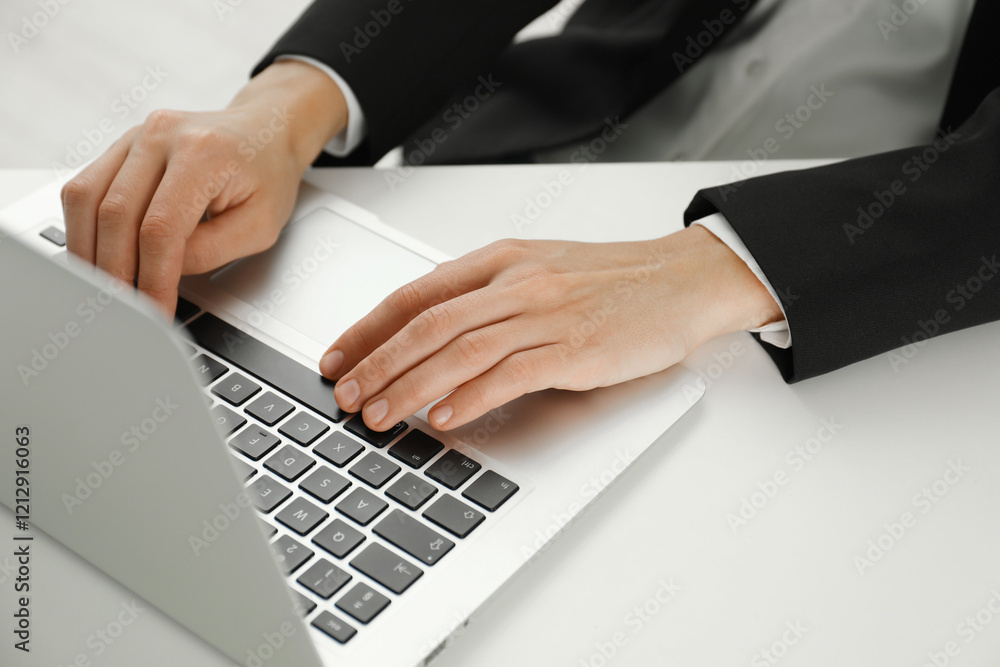 Businesswoman using laptop at white table indoors, closeup. Modern technology Businesswoman using laptop at white table indoors, closeup. Modern technology
