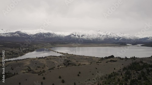 Huge lake with mountains in the background on a cloudy day in argentinian patagonia. 