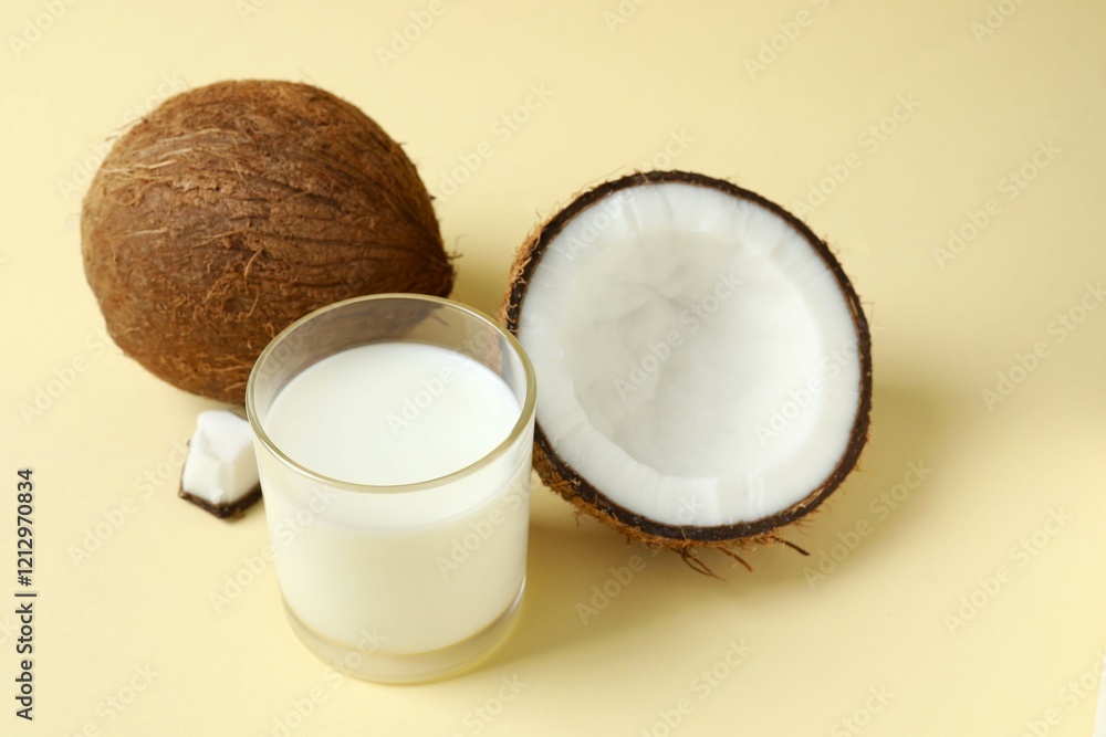 Glass of milk with coconuts on the table Glass of milk with coconuts on the table