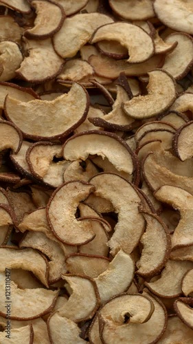 Dried sliced Chojuro pears. Selective focus. Vertical video. photo