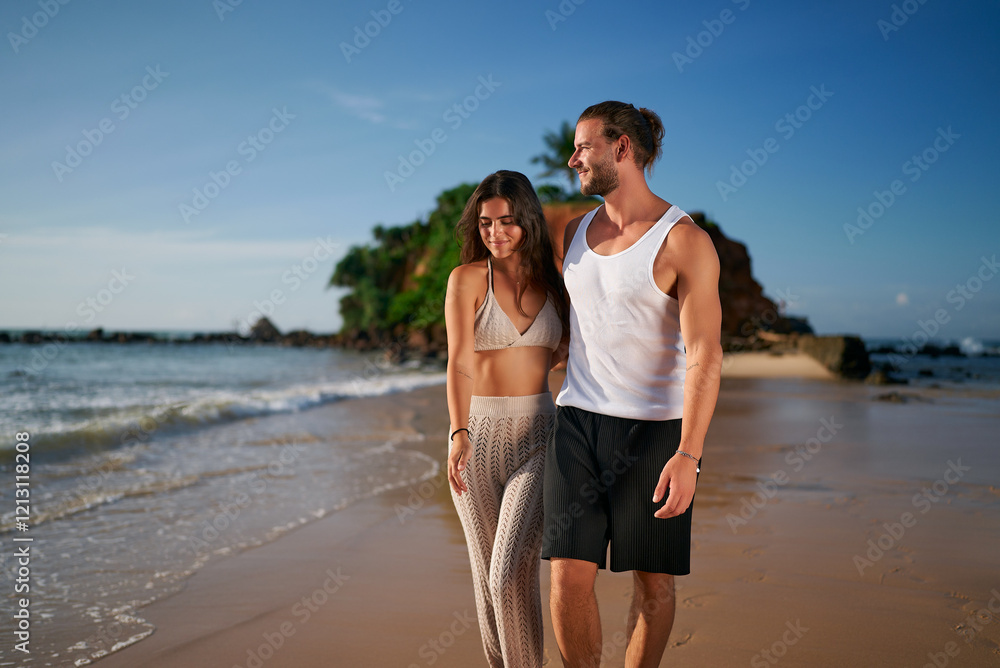 Adult couple enjoys serene beach walk at sunset. Carefree duo without kids strolls along shoreline. Romantic partners embrace leisure, sea vacation, childfree lifestyle. Casual, love, travel, summer. Adult couple enjoys serene beach walk at sunset. Carefree duo without kids strolls along shoreline. Romantic partners embrace leisure, sea vacation, childfree lifestyle. Casual, love, travel, summer.