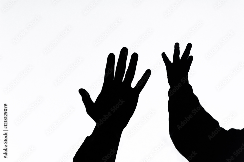 Shadow, silhouette from the hands of a child and woman mother, family on a white wall, background, showing love. Photography, gesturing concept, lifestyle. Shadow, silhouette from the hands of a child and woman mother, family on a white wall, background, showing love. Photography, gesturing concept, lifestyle.