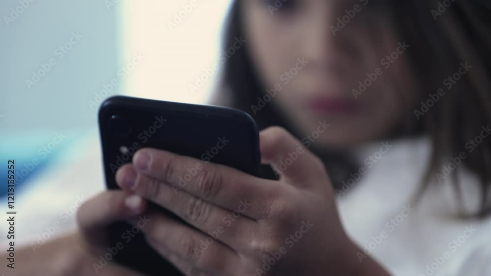 Kid Focused on Smartphone, Close-Up of Hands Holding Cellphone and Browsing Social Media Kid Focused on Smartphone, Close-Up of Hands Holding Cellphone and Browsing Social Media