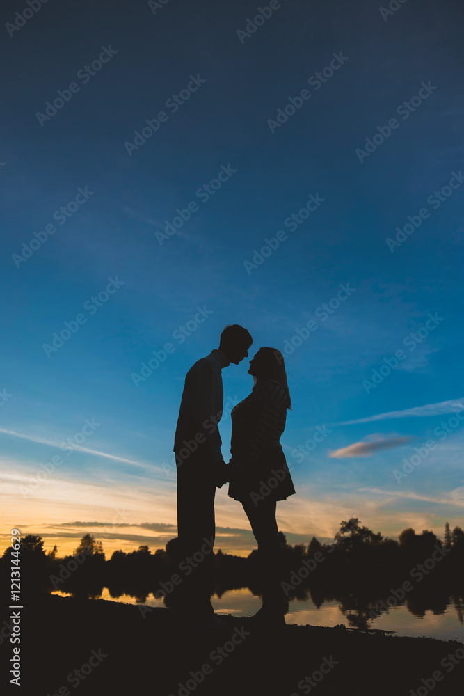 Couple in love on the background of the setting sun Couple in love on the background of the setting sun