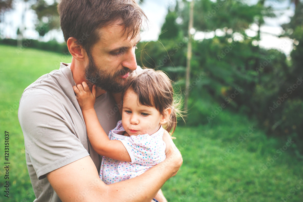 Father embracing his daughter in a lush green park during summer, capturing a tender and emotional moment of love and care, concept of family and nature Father embracing his daughter in a lush green park during summer, capturing a tender and emotional moment of love and care, concept of family and nature