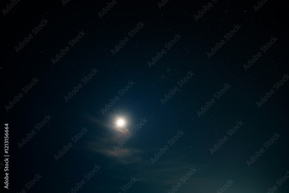 Naklejka premium starry sky and moon at night as an abstract background