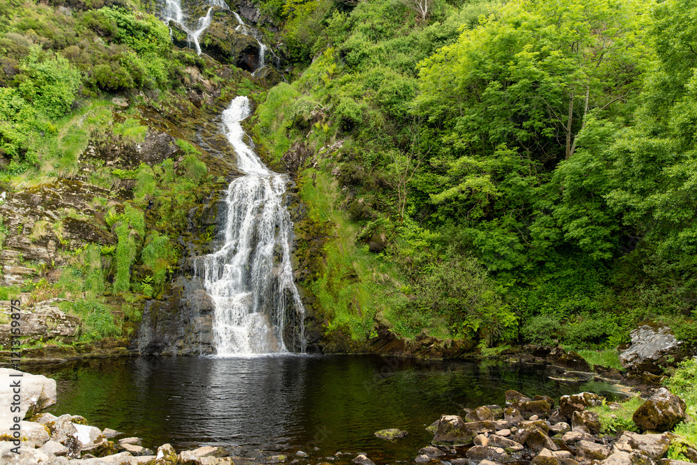 Obraz premium Assaranca Waterfall, one of Donegal's most beautiful waterfalls. Hidden gem that must-see for tourists visiting the region. Stunning natural attraction near Maghera Beach and Caves.