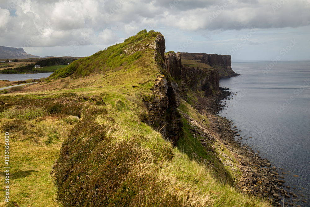 The grassy landscape of Scotland’s Isle of Skye meets the Atlantic Ocean via its dramatic cliffs. The grassy landscape of Scotland’s Isle of Skye meets the Atlantic Ocean via its dramatic cliffs.