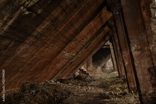 Reinforced concrete pillars of an abandoned and crumbling industrial building photo