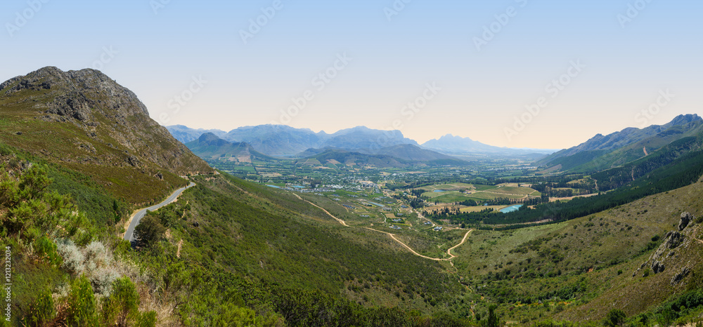 Naklejka premium Panorama shot of Franschhoek Valley surrounded by mountains, Franschhoek, South Africa