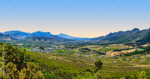 Wide-angle view of the scenic Franschhoek Valley surrounded by majestic mountains, Franschhoek, South Africa