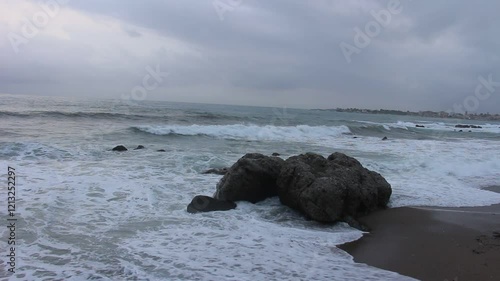 Storm in Italy, Sicilia. Big waves in sunny or cloudy day.