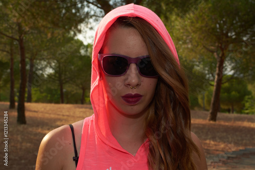 Canvas Print Young brown-haired woman wearing dark glasses.