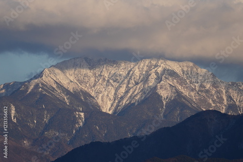 Mt. Senjogatake in the snow-covered sunset in Komagane City, Nagano Prefecture, Japan in winter photo