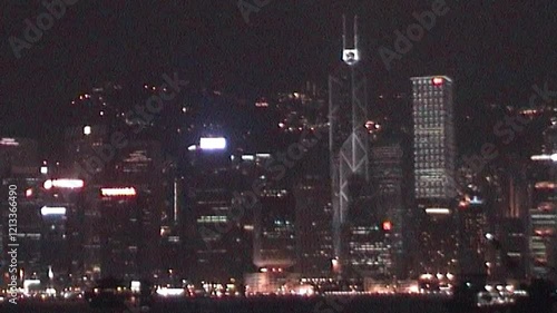 Boat Sailing Through Hong Kong Harbor With Stunning Nighttime Cityscape