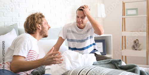 Young gay couple in quarrel...