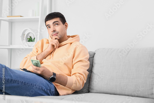 Thoughtful young man with m...