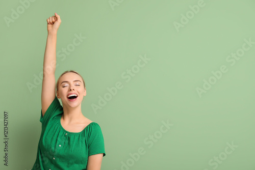 Happy young woman celebrati...