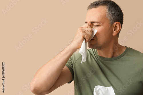 Ill mature man with tissues...