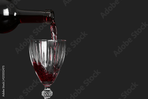Pouring of red wine from bo...