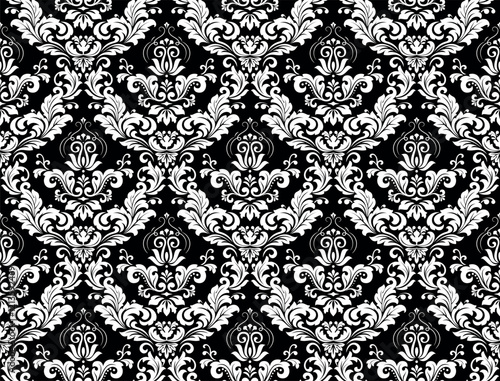 Wallpaper in the style of Baroque. Seamless vector background. White and black floral ornament. Graphic pattern for fabric, wallpaper, packaging. Ornate Damask flower ornament.