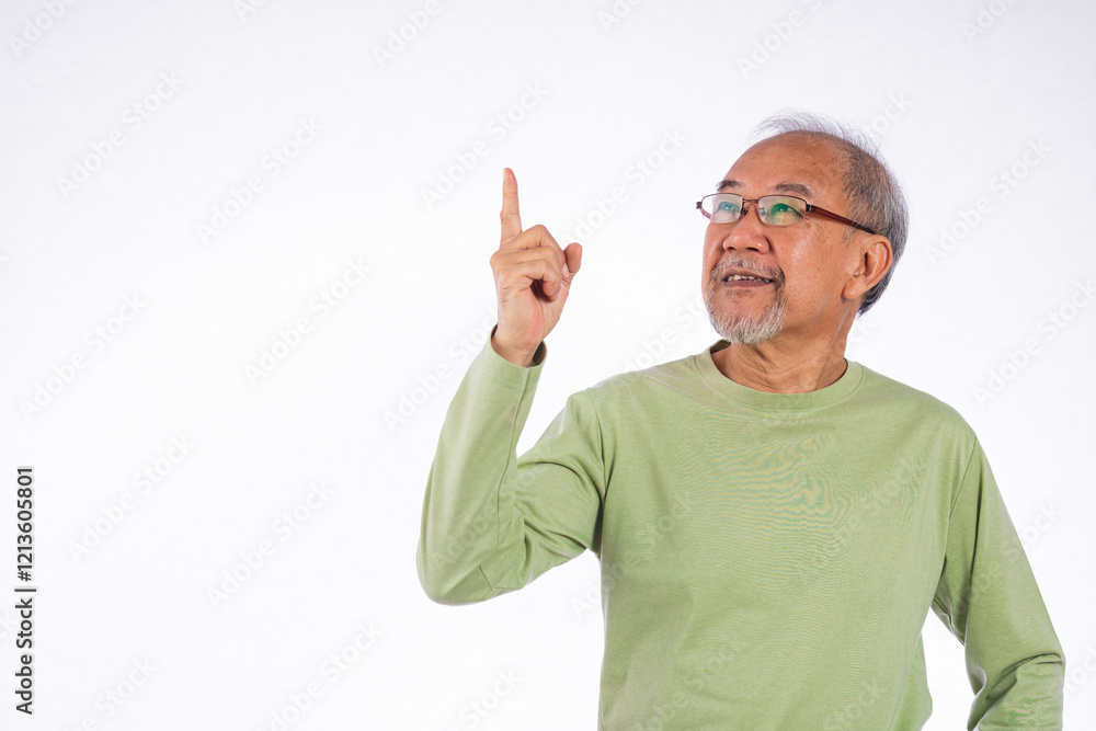 Naklejka premium Portrait Asian grey haired with glasses senior man point index fingers to space studio shot isolated on white background, elderly old man pointing finger up