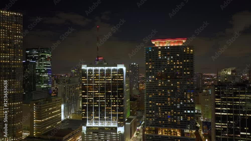 Aerial view of downtown district of of Miami Brickell in Florida, USA. Brightly illuminated high skyscraper buildings in modern American midtown. Aerial view of downtown district of of Miami Brickell in Florida, USA. Brightly illuminated high skyscraper buildings in modern American midtown.