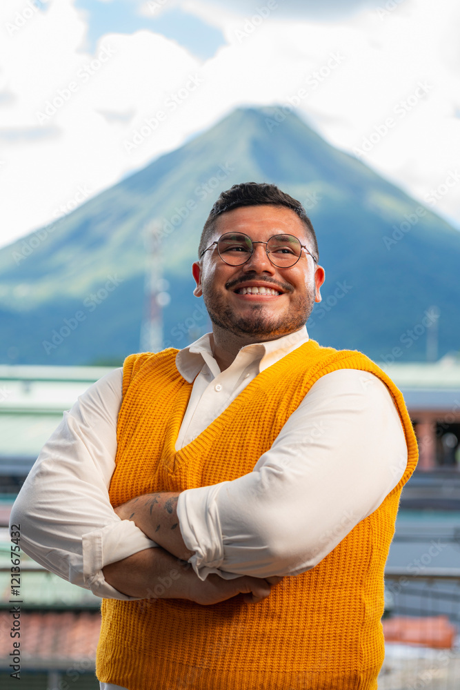 Fototapeta premium Photograph of happy gay man with a volcano in the background