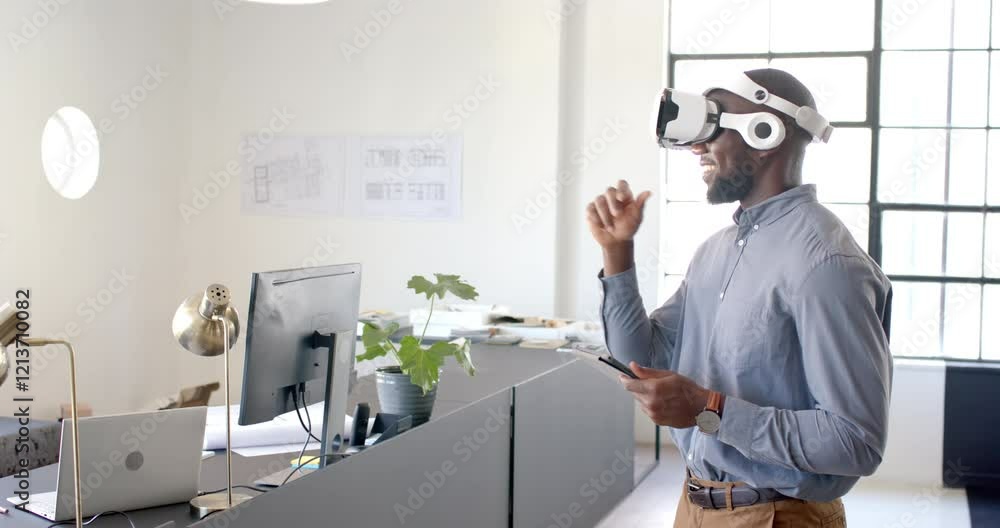 Using VR headset, man interacting with virtual interface in modern office Using VR headset, man interacting with virtual interface in modern office
