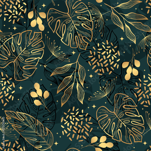 Golden tropical leaves on a green  background. Seamless pattern. Botanical background.