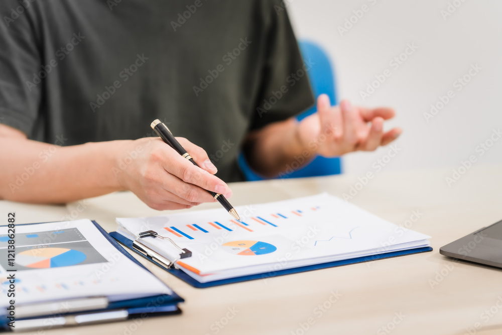 A businessman sitting at a desk in an office, using a laptop, representing accounting, finance,business planning, managing financial data,strategizing business growth,overseeing financial operations A businessman sitting at a desk in an office, using a laptop, representing accounting, finance,business planning, managing financial data,strategizing business growth,overseeing financial operations