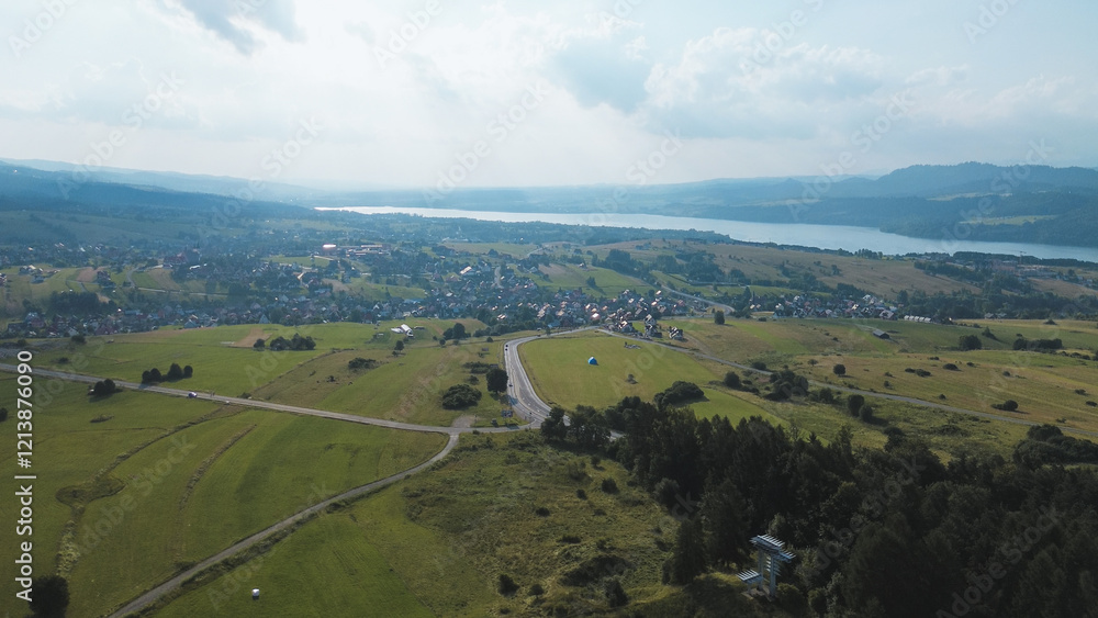 Fototapeta premium Beautiful aerial view of Lake Czorsztyn and nearby village
