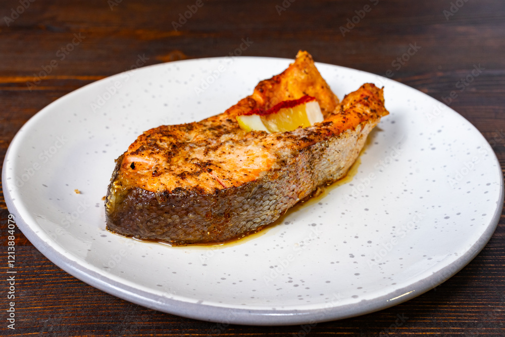 Grilled salmon fillet on white plate with smoky seasoning Savory vegetable pie served with fresh garnishes on a white plate Grilled salmon fillet on white plate with smoky seasoning Savory vegetable pie served with fresh garnishes on a white plate