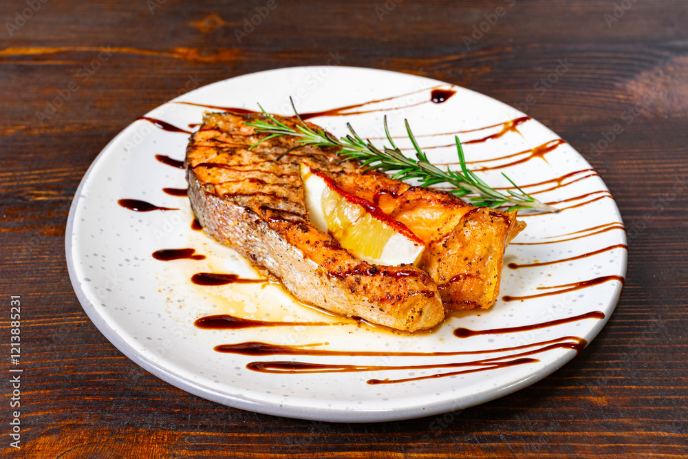 Grilled salmon steak with citrus glaze and herbs on a rustic plate Savory vegetable pie served with fresh garnishes on a white plate Grilled salmon steak with citrus glaze and herbs on a rustic plate Savory vegetable pie served with fresh garnishes on a white plate