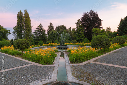 Typical symmetrical Italian garden (giardino all'italiana) or formal garden (giardino formale) in Varese city, Italy. Public gardens of Villa Toeplitz (Toeplitz palace) made in the early 1900s